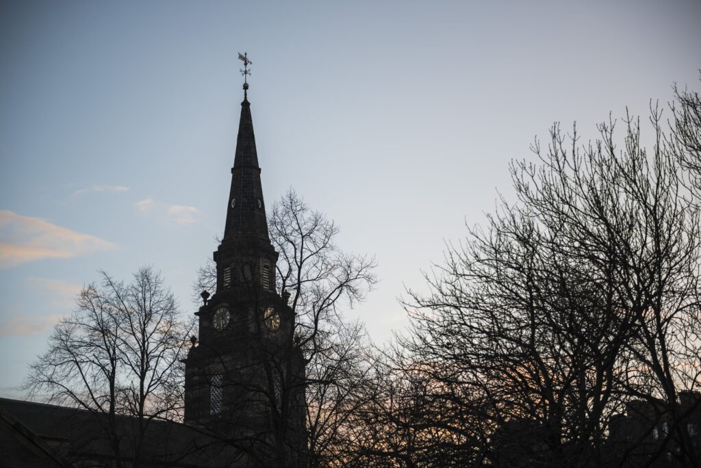 Church top outside with sunset